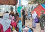 Anggota Koramil 29/Langkahan Kawal Pengobatan Gratis bagi Korban Banjir Bandang di Langkahan