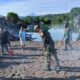 Wujudkan Lingkungan Asri, Koramil 03 Likupang Karya Bakti Bersihkan Pesisir Pantai Desa Likupang Kampung Ambong