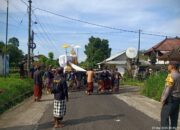 Bhabinkamtibmas Desa Cau Belayu Pengamanan Upacara Ngaben