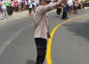 Bhabinkamtibmas Desa Batunya Amankan Upacara Ngaben di Banjar Tamantada