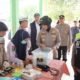 Polres Ogan Ilir Bagikan Masker dan Obat untuk Jaga Kesehatan Warga di Indralaya Utara